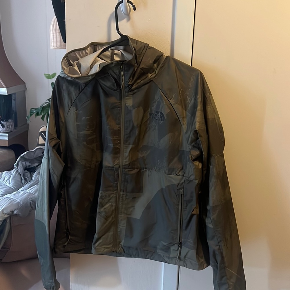 North face wind breaker jacket. Good for warm weather with a little breeze.